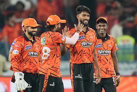 Rajasthan Royals' Praful Hinge, centre, celebrates the wicket of Rajasthan Royals' Vaibhav Sooryavanshi during the Indian Premier League cricket match between Sunrisers Hyderabad and Rajasthan Royals in Hyderabad.