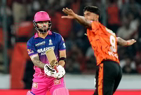 Sunrisers Hyderabad's Praful Hinge, second right, celebrates the wicket of Rajasthan Royals' captain Riyan Parag during the Indian Premier League cricket match between Sunrisers Hyderabad and Rajasthan Royals in Hyderabad.