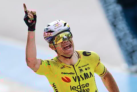 Belgium's Wout van Aert crosses the finish line to win the Paris-Roubaix cycling race in Roubaix, France pointing his finger skywards to commemorate Belgian cyclist Michael Goolaerts who died after crashing in the race in 2018. 
