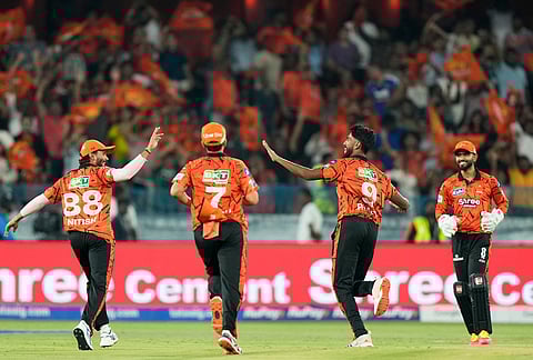 Sunrisers Hyderabad's Praful Hinge, second right, celebrates the wicket of Rajasthan Royals' captain Riyan Parag during the Indian Premier League cricket match between Sunrisers Hyderabad and Rajasthan Royals in Hyderabad.