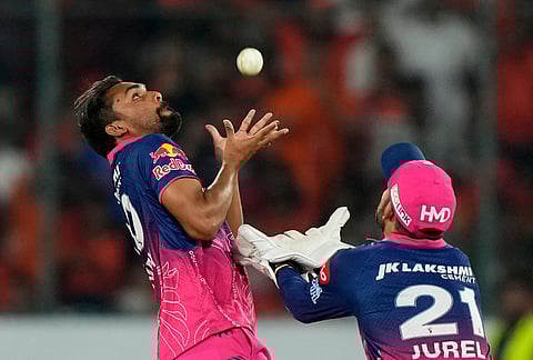 Rajasthan Royals' Sandeep Sharma, left, takes the catch to dismiss Sunrisers Hyderabad's captain Ishan Kishan during the Indian Premier League cricket match between Sunrisers Hyderabad and Rajasthan Royals in Hyderabad.