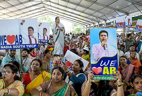 TMC supporters gather during a rally in support of the party candidate from Ranaghat Uttar Paschim constituency, Tapas Ghosh, unseen, ahead of the West Bengal Assembly elections, in Nadia.