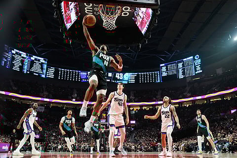 Portland Trail Blazers guard Scoot Henderson (00) goes to the basket during the first half of an NBA basketball game against the Sacramento Kings in Portland, Ore.