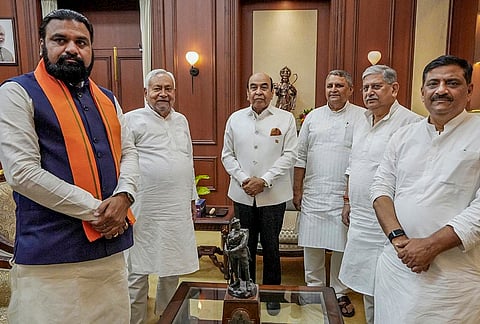 Bihar Chief Minister Nitish Kumar with Governor Syed Ata Hasnain after submitting his resignation, in Patna. Deputy Chief Minister Samrat Choudhary, Union Minister Rajiv Ranjan (Lalan) and others are also seen. 
