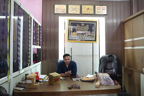 Liaqat Ali, 36, overseeing his hydraulics business in Tri Nagar where the violence took place. 