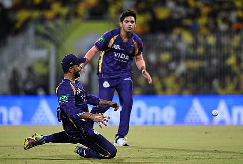 Kolkata Knight Riders' captain Ajinkya Rahane, left, misfields the ball during the Indian Premier League cricket match between Chennai Super Kings and Kolkata Knight Riders in Chennai.