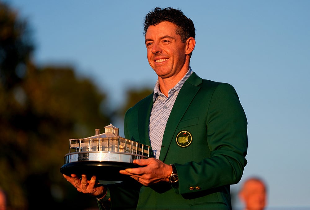 Rory McIlroy, of Northern Ireland, holds the trophy after winning the Masters golf tournament at the Augusta National Golf Club in Augusta, Georgia. - | Photo: AP/Ashley Landis