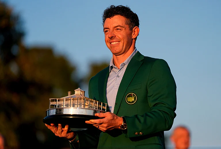 Rory McIlroy, of Northern Ireland, holds the trophy after winning the Masters golf tournament at the Augusta National Golf Club in Augusta, Georgia. - | Photo: AP/Ashley Landis