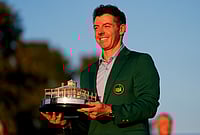 | Photo: AP/Ashley Landis : Rory McIlroy, of Northern Ireland, holds the trophy after winning the Masters golf tournament at the Augusta National Golf Club in Augusta, Georgia.