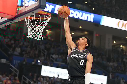 Phoenix Suns forward Ryan Dunn dunks during the first half of an NBA basketball game against the Oklahoma City Thunder in Oklahoma City.