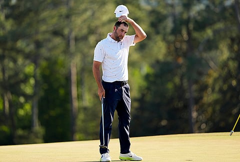 Scottie Scheffler finishes his final round of the Masters golf tournament at the Augusta National Golf Club, in Augusta, Georgia.