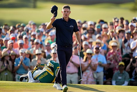 Justin Rose, of England, walks to green on the 18th hole during the final round of the Masters golf tournament at the Augusta National Golf Club, in Augusta, Georgia.