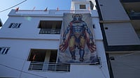 Photo: Subhashree Rath : Large flex print of Varaha hanging on the facade of one of the residential buildings in Tri Nagar.