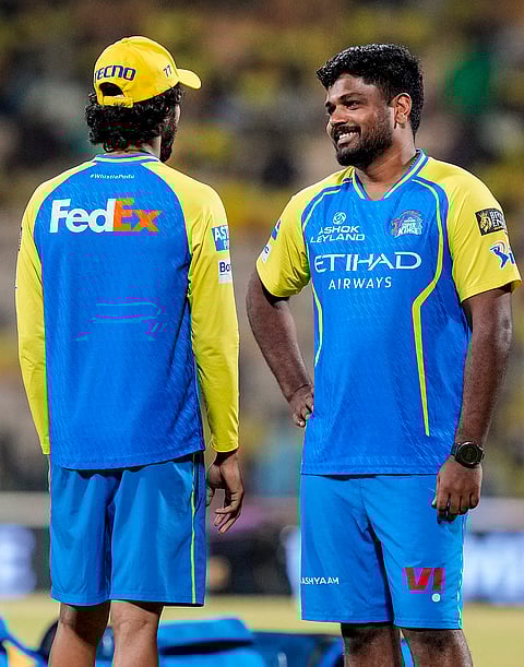 Chennai Super Kings' Sanju Samson, right, during a warm-up before the Indian Premier League (IPL) 2026 T20 cricket match between Chennai Super Kings and Kolkata Knight Riders, at MA Chidambaram Stadium in Chennai, Tamil Nadu.