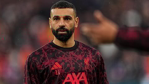 Mohamed Salah pauses during the warm-up before the Champions League quarter-final second leg match between Liverpool and Paris Saint-Germain in Liverpool.