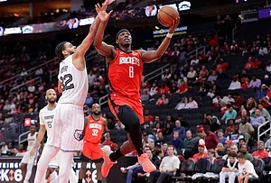 | Photo: AP/Michael Wyke : Houston Rockets forward Jae'sean Tate (8) puts up a shot pastMemphis Grizzlies guard Rayan Rupert (32) during the second half of an NBA basketball game in Houston.