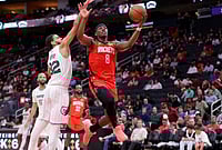 Houston Rockets Vs Memphis Grizzlies, NBA 2026: Rockets Clinch 5th Seed With Dominant Victory | Photo: AP/Michael Wyke : Houston Rockets forward Jae'sean Tate (8) puts up a shot pastMemphis Grizzlies guard Rayan Rupert (32) during the second half of an NBA basketball game in Houston.