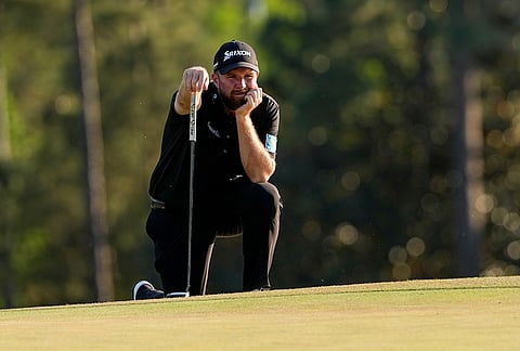 Shane Lowry, of Ireland, waits to putt on the 18th hole during the final round of the Masters golf tournament at the Augusta National Golf Club, in Augusta, Georgia.