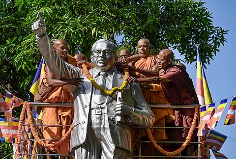 Buddhist monks offer a garland to the statue of Dr BR Ambedkar on his birth anniversary, observed as ‘Ambedkar Jayanti’, at Bodh Gaya, in Gayaji district, Bihar.