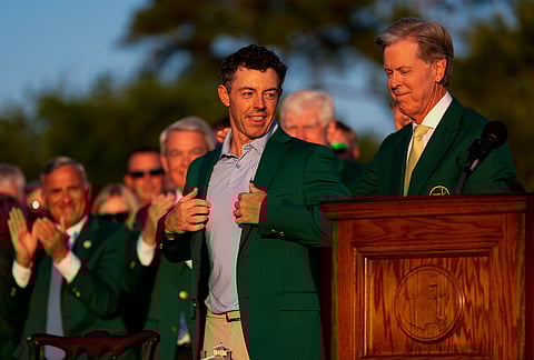 Augusta National Golf Club chairman Fred Ridley puts the green Jacket on Rory McIlroy, of Northern Ireland, after the Masters golf tournament at the Augusta National Golf Club in Augusta, Georgia.