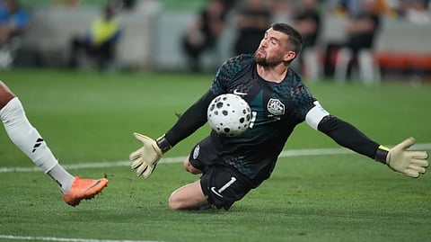 Australia's goalkeeper Matthew Ryan makes a save during their international soccer friendly against Curacao in Melbourne, Australia, Tuesday, March 31, 2026.
