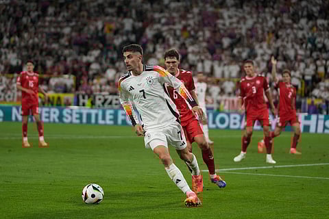 Germany's Nick Woltemade, left, celebrates after scoring the opening goal of his team during the World Cup 2026 group A qualifying soccer match between Northern Ireland and Germany at Windsor Park stadium, in Belfast, Northern Ireland, Monday, Oct. 13, 2025.