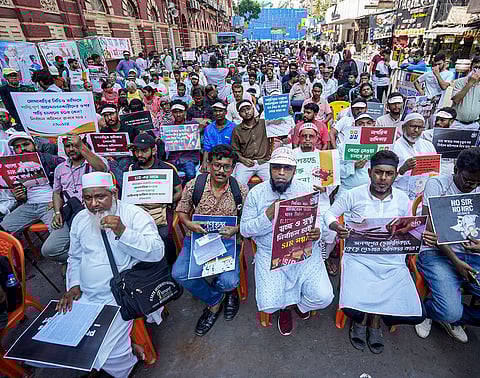 Members of Votadhikar Raksha Mancha stage a protest demanding voting rights for deleted voters ahead of the West Bengal Assembly elections, in Kolkata.