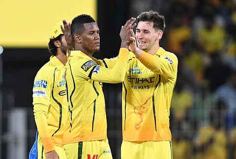 Chennai Super Kings' Akeal Hosein, center, celebrates with teammates the wicket of Kolkata Knight Riders' Angkrish Raghuvanshi during the Indian Premier League cricket match between Chennai Super Kings and Kolkata Knight Riders in Chennai.