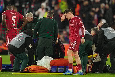 Liverpool's Florian Wirtz reacts as she stretcher comes out for teammate Hugo Ekitike during the Champions League quarterfinal second leg soccer match between Liverpool and Paris Saint-Germain in Liverpool, England, Tuesday, April 14, 2026.