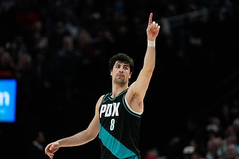 Portland Trail Blazers forward Deni Avdija reacts during the second half of an NBA basketball game against the Sacramento Kings in Portland, Ore.
