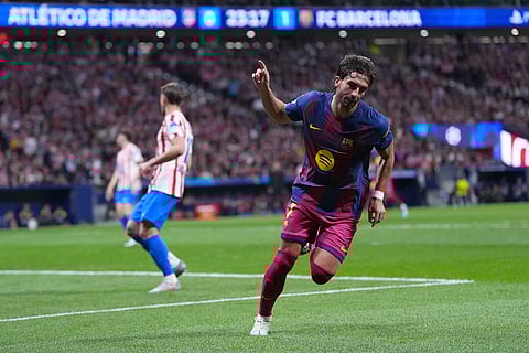 Barcelona's Ferran Torres celebrates after scoring his side's second goal the Champions League quarterfinal second leg soccer match between Atletico Madrid and Barcelona in Madrid, Spain.