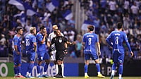 (AP Photo/Eduardo Verdugo) : Referee Ivan Barton suspends the match due to discriminatory chants from the crowd during a CONCACAF Champions Cup quarterfinal second leg soccer match between Mexico's Cruz Azul and the United States' Los Angeles FC in Puebla, Mexico, Tuesday, April 14, 2026.