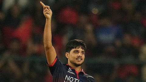 Royal Challengers Bengaluru's Rasikh Salam celebrates the wicket of Lucknow Super Giants' Aiden Markram during their Indian Premier League match in Bengaluru.