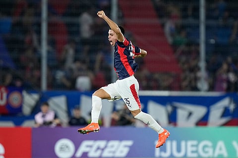 Marcelo Chaparro of Paraguay's Cerro Porteño celebrates after his teammate Jonatan Torres scored their side's opening goal against Colombia's Junior during a Copa Libertadores Group F soccer match in Asuncion, Paraguay.