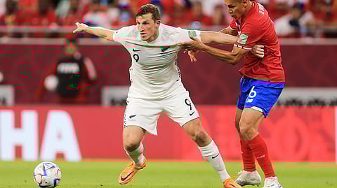 New Zealand's Chris Wood, left, and Costa Rica's Oscar Duarte fightduring the World Cup 2022 qualifying play-off soccer match between New Zealand and Costa Rica in Al Rayyan, Qatar, Tuesday, June 14, 2022.