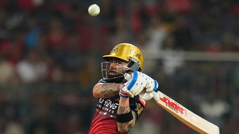 Royal Challengers Bengaluru's Virat Kohli hits a boundary during the Indian Premier League cricket match between Royal Challengers Bengaluru and Lucknow Super Giants in Bengaluru, India, Wednesday, April 15, 2026. - AP Photo/Aijaz Rahi