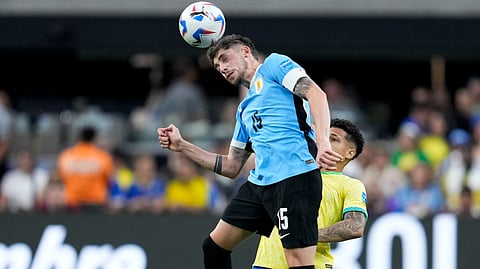 Uruguay's Federico Valverde heads the ball past Brazil's Joao Gomes during a Copa America quarterfinal soccer match in Las Vegas, Saturday, July 6, 2024. 