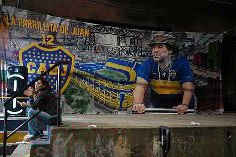 A poster of late Argentine soccer player Diego Maradona hangs outside La Bombonera Stadium after a Copa Libertadores Group D match between Argentina's Boca Juniors and Ecuador's Barcelona in Buenos Aires, Argentina.
