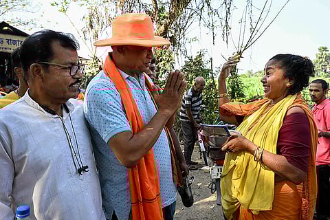 BJP candidate for Santipur constituency, Swapan Kumar Das, second left, greets on the occasion of ‘Poila Boishakh’ (Bengali New Year) as part of an election campaign ahead of the West Bengal Assembly Election, in Nadia district.
