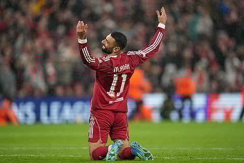 Liverpool's Mohamed Salahr eacts during the Champions League quarterfinal second leg soccer match between Liverpool and Paris Saint-Germain in Liverpool, England.