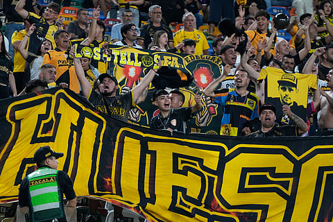Chile's Coquimbo Unido fans cheer for their team prior to a Copa Libertadores Group B soccer match against Peru's Universitario in Lima, Peru.