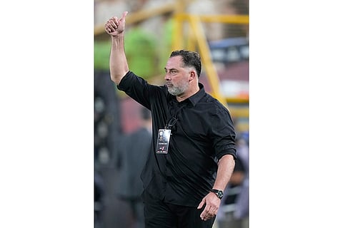Coach Hector Caputto of Chile's Coquimbo Unido gestures during a Copa Libertadores Group B soccer match against Peru's Universitario in Lima, Peru.