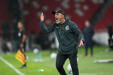 Coach Rafael Guanaes of Brazil's Mirassol instructs his players during a Copa Libertadores Group G soccer match against Ecuador's Liga Deportiva Universitaria in Quito, Ecuador.
