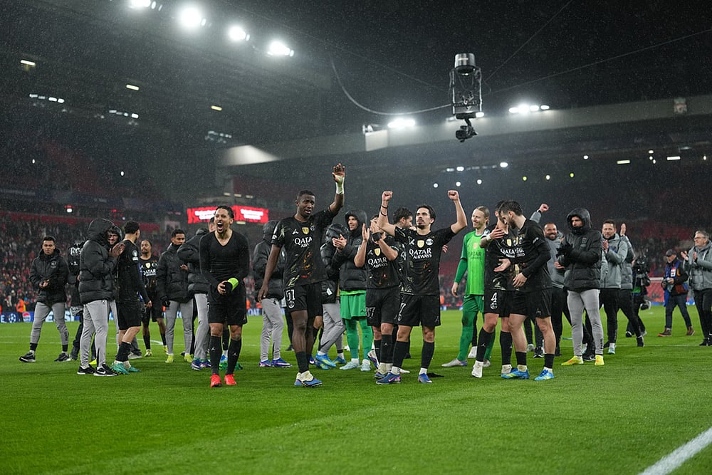 PSG players celebrate after the Champions League quarterfinal second leg soccer match between Liverpool and Paris Saint-Germain in Liverpool, England. - | Photo: AP/Jon Super