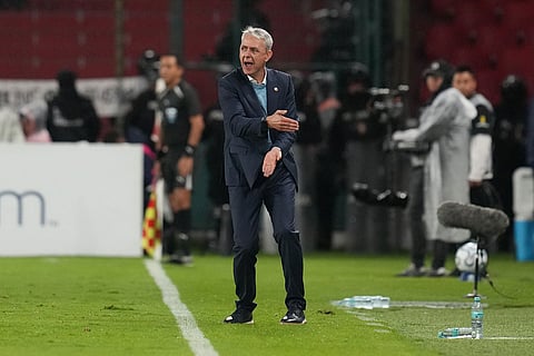Coach Tiago Nunes of Ecuador's Liga Deportiva Universitaria instructs his players during a Copa Libertadores Group G soccer match against Brazil's Mirassol in Quito, Ecuador.
