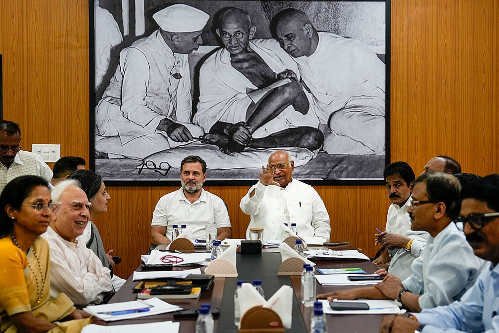 Congress President Mallikarjun Kharge and party leaders Rahul Gandhi and KC Venugopal, Shiv Sena (UBT) leader Sanjay Raut, NCP(SP) leader Supriya Sule, TMC leader Sagarika Ghose, DMK leader TR Baalu and other leaders during INDIA bloc meeting at Kharge's residence, in New Delhi. - | Photo: PTI/Salman Ali