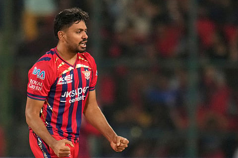 Lucknow Super Giants' Avesh Khan celebrates the wicket of Royal Challengers Bengaluru's Virat Kohli during the Indian Premier League cricket match between Royal Challengers Bengaluru and Lucknow Super Giants in Bengaluru, India.