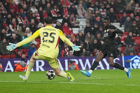 PSG's Ousmane Dembele scores his side's second goal during the Champions League quarterfinal second leg soccer match between Liverpool and Paris Saint-Germain in Liverpool, England.