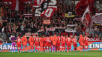 | Photo: dpa/Christian Charisius via AP : Bayern's Munich's players acknowledge fans at the end of the German Bundesliga soccer match between FC St. Pauli and Bayern Munich in Hamburg, Germany, Saturday, April 11, 2026.