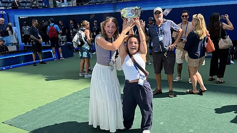 Erin Routliffe’s sisters, Tess and Tara, celebrating her victory.